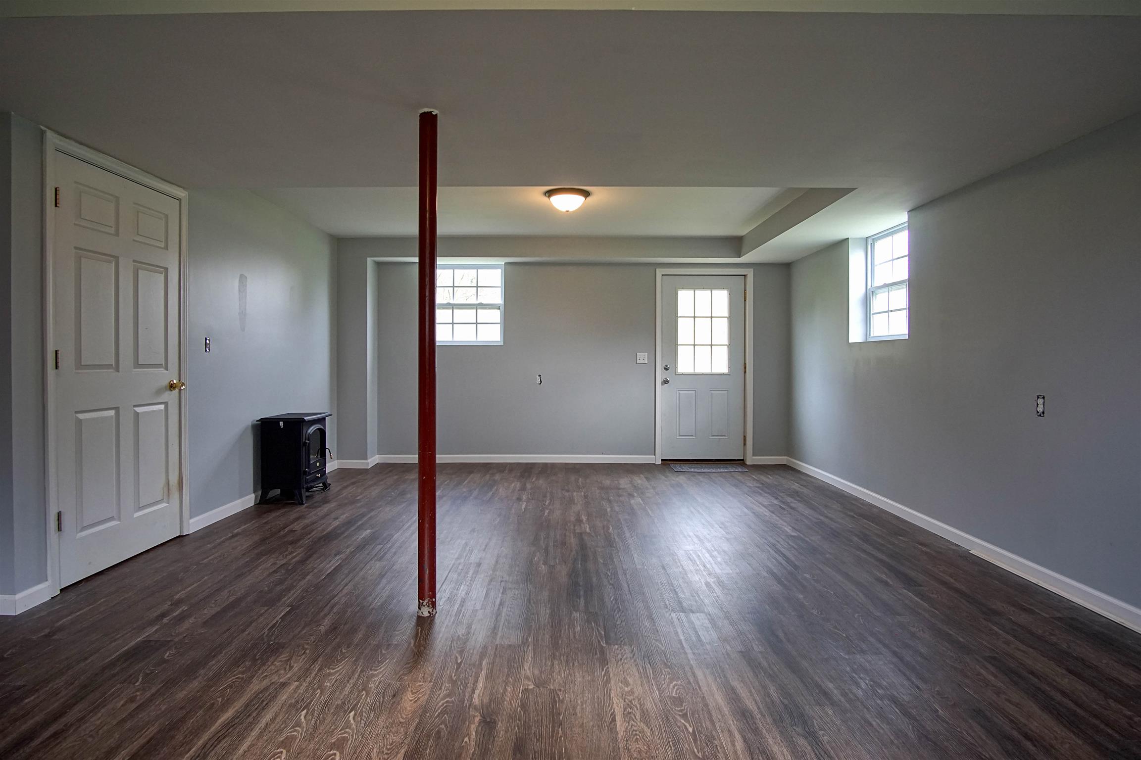 5194 William Woodard Road Springfield, TN 37172 - Photo 19 of 23 an empty room with wooden floor and windows