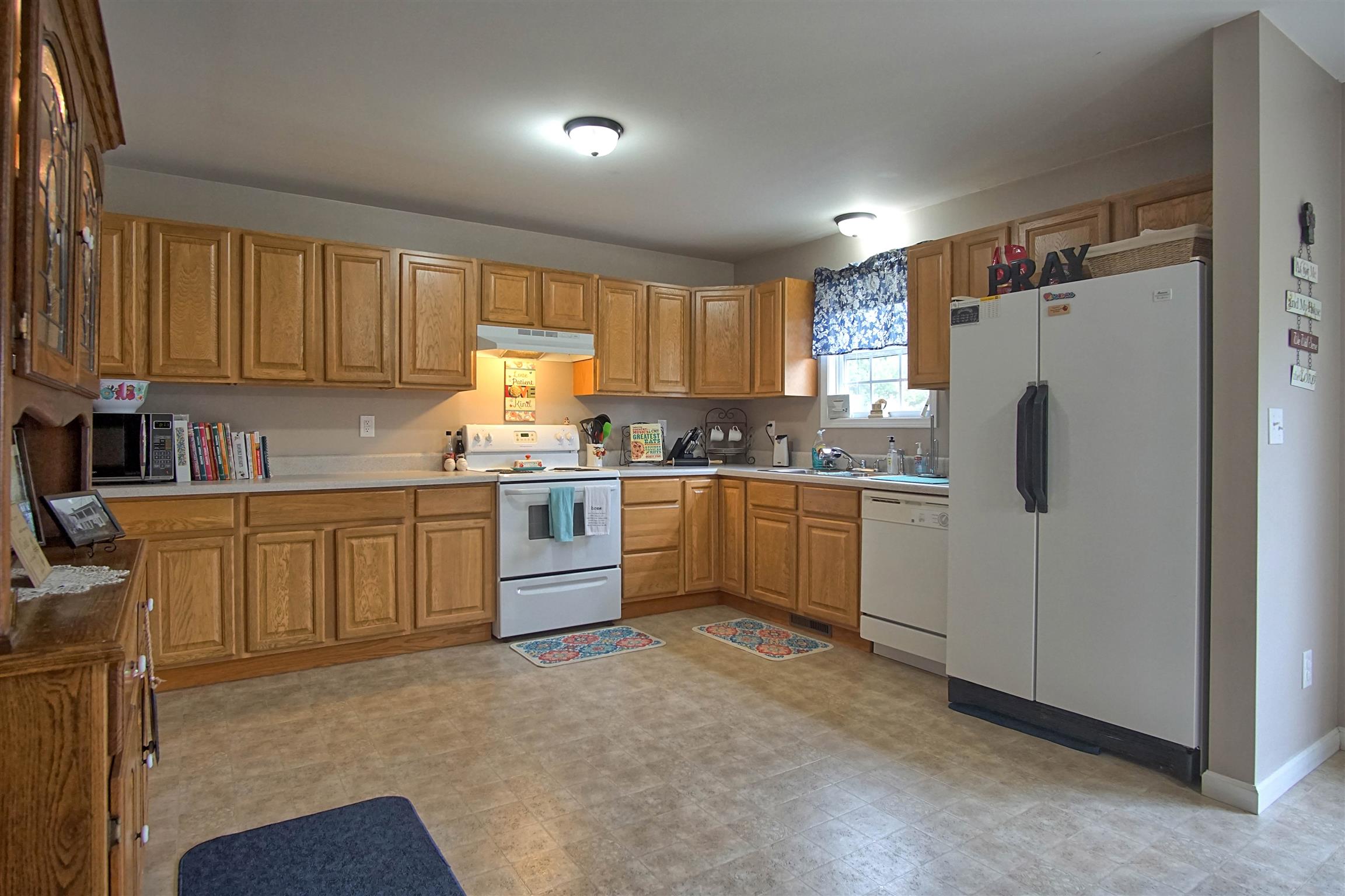 5194 William Woodard Road Springfield, TN 37172 - Photo 8 of 23 a kitchen with a refrigerator sink and cabinets