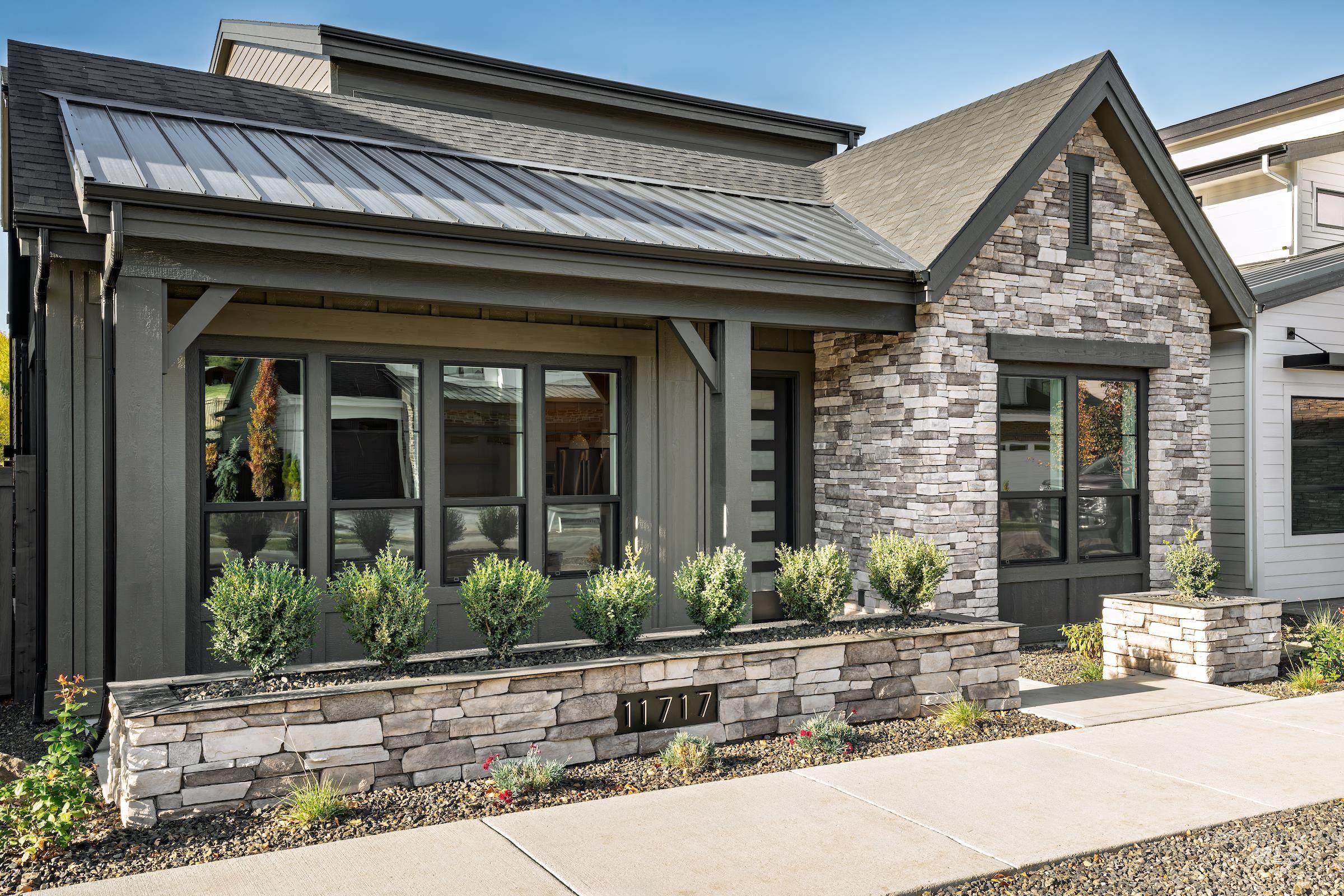 11717 North Rabbitbrush Way Boise, ID 83714 - Photo 32 of 33 View of exterior entry with a metal roof and stone siding