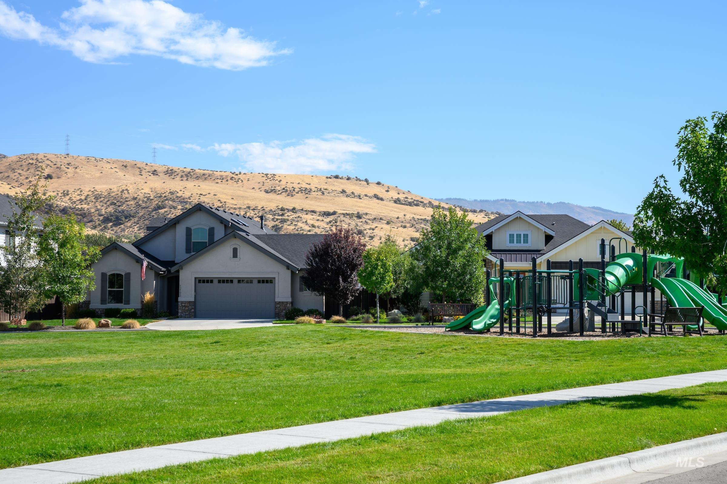 11717 North Rabbitbrush Way Boise, ID 83714 - Photo 6 of 33 Communal playground featuring a yard and a mountain view