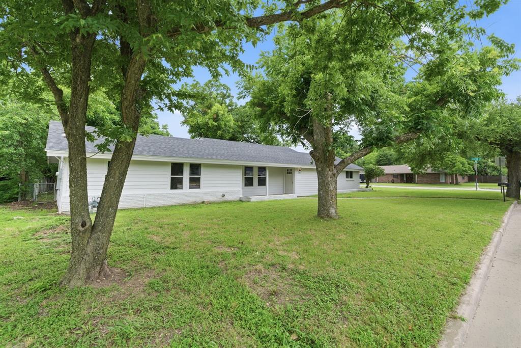 507 Country Club Road Cleburne, TX 76033 - Photo 2 of 39 Ranch-style exterior with white siding and a dark shingle roof