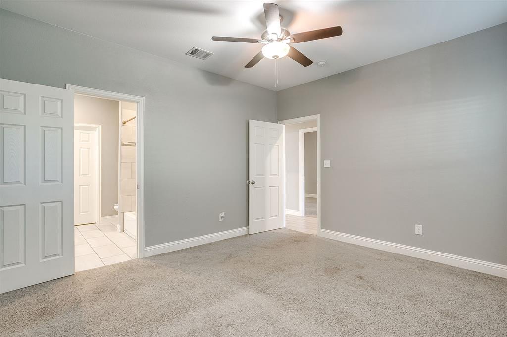 3901 Baylor Street Fort Worth, TX 76119 - Photo 25 of 40 a view of an empty room and a ceiling fan