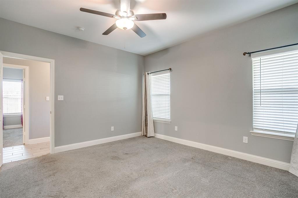 3901 Baylor Street Fort Worth, TX 76119 - Photo 26 of 40 an empty room with windows and fan