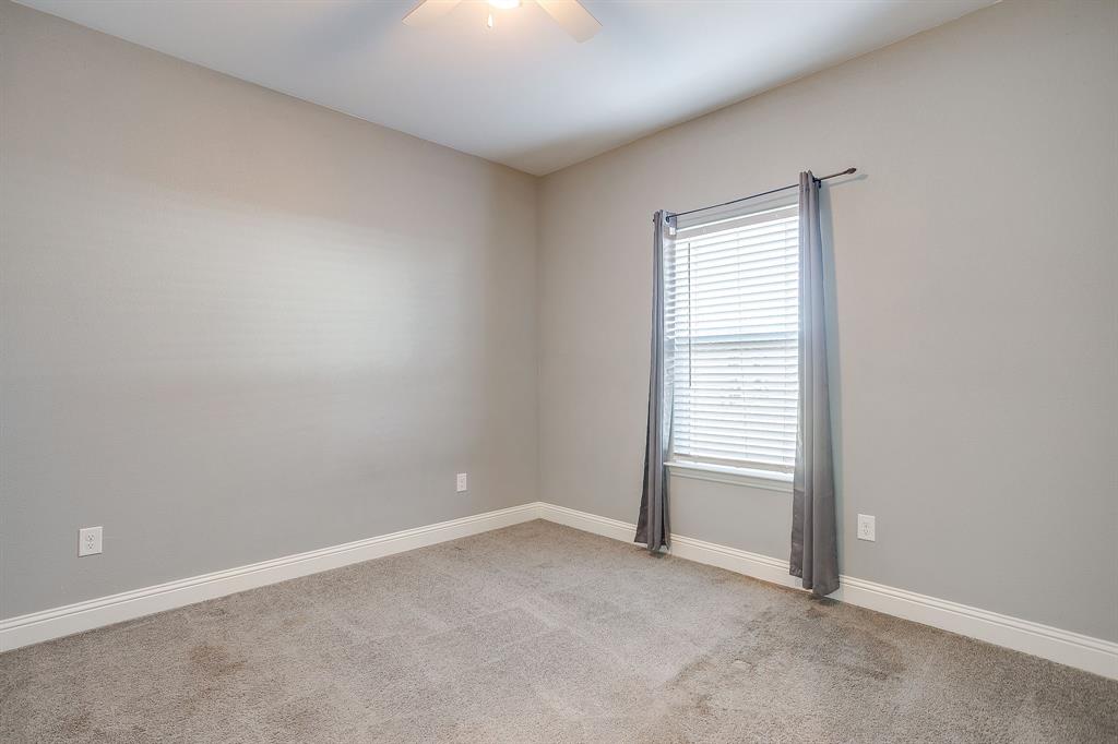 3901 Baylor Street Fort Worth, TX 76119 - Photo 34 of 40 an empty room with windows