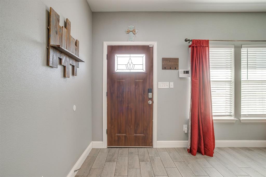 3901 Baylor Street Fort Worth, TX 76119 - Photo 8 of 40 a view of front door with hallway