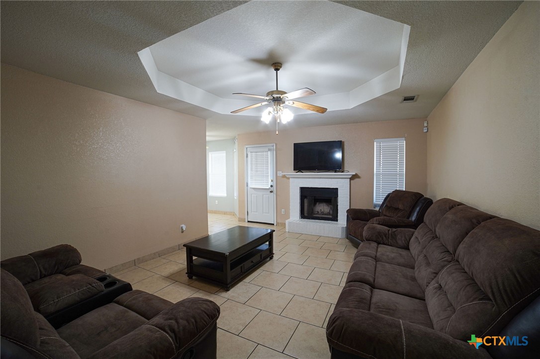 805 James Loop Killeen, TX 76542 - Photo 11 of 31 a living room with furniture a fireplace and a flat screen tv