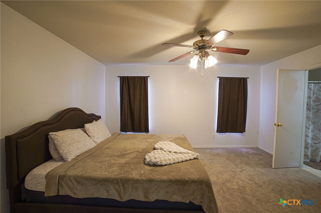 805 James Loop Killeen, TX 76542 - Photo 17 of 31 a bedroom with a bed and ceiling fan