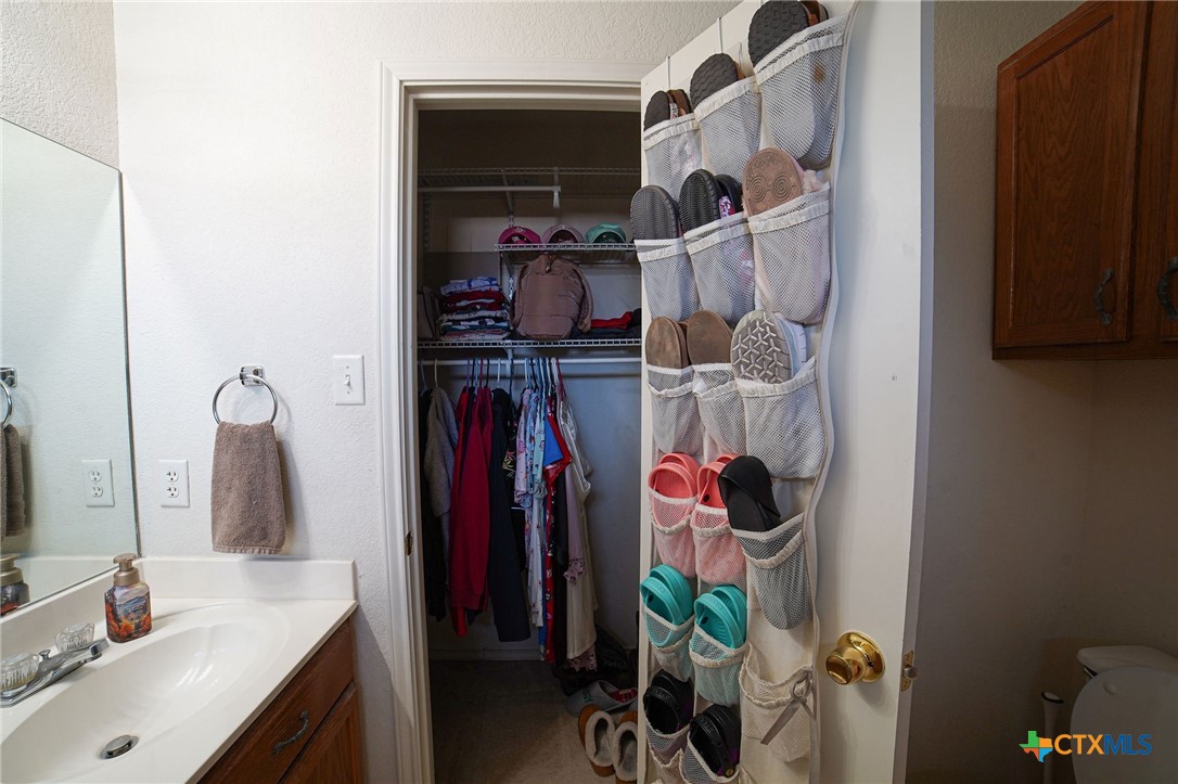 805 James Loop Killeen, TX 76542 - Photo 20 of 31 a bathroom with a sink mirror and shower