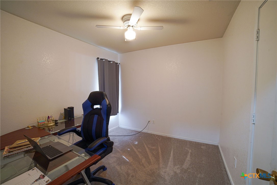 805 James Loop Killeen, TX 76542 - Photo 26 of 31 a workspace with furniture and chandelier