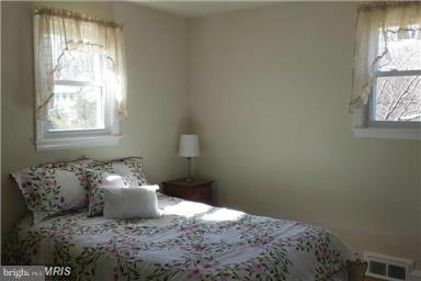 5601 Ranelagh Road White Marsh, MD 21162 - Photo 5 of 12 a bedroom with a bed and window