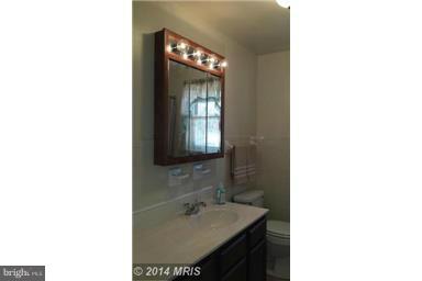 5601 Ranelagh Road White Marsh, MD 21162 - Photo 8 of 12 a bathroom with a sink and a mirror