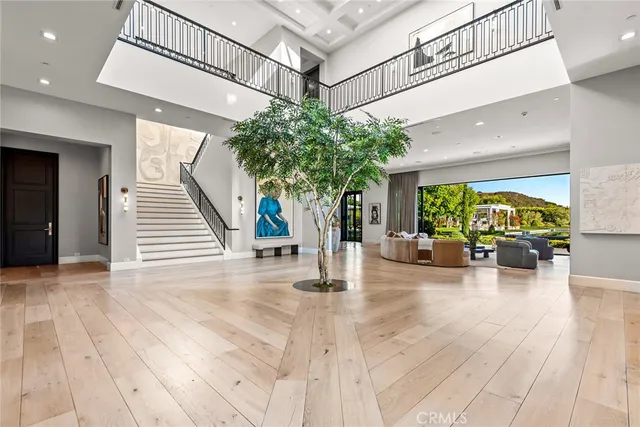 an entryway with wooden floor
