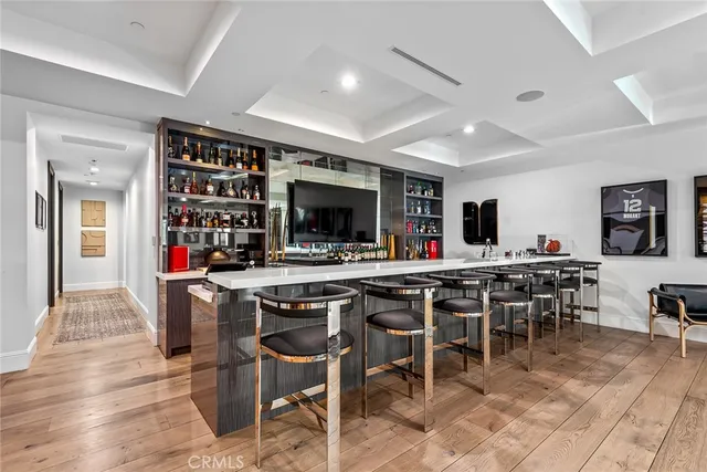 a view of a hallway with closet and wooden floor