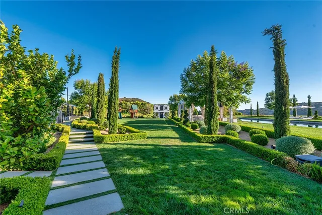 a view of a house with swimming pool and porch with furniture