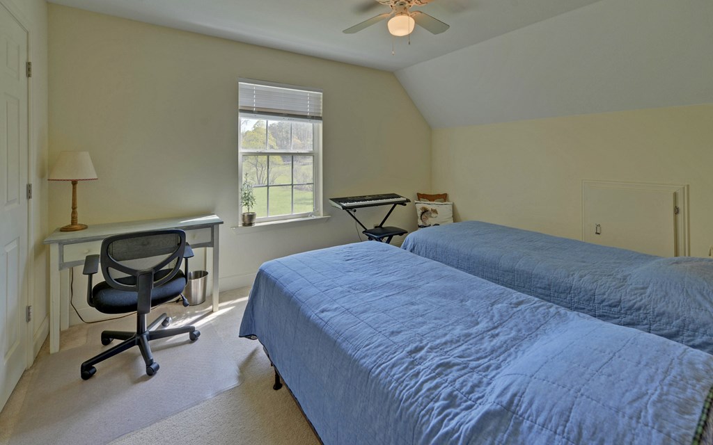 202 Dove Lane Morganton, GA 30560 - Photo 17 of 99 a bedroom with a bed and a desk