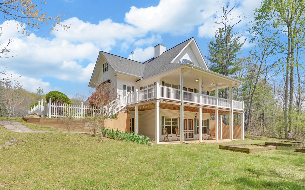 202 Dove Lane Morganton, GA 30560 - Photo 22 of 99 a view of a large building with a big yard and large trees
