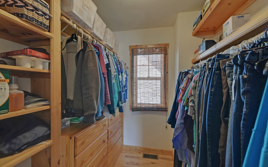 202 Dove Lane Morganton, GA 30560 - Photo 33 of 99 a view of walk in closet with clothes and shoes
