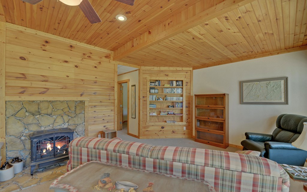 202 Dove Lane Morganton, GA 30560 - Photo 42 of 99 a bedroom with furniture and a fireplace