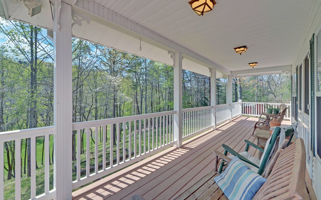 202 Dove Lane Morganton, GA 30560 - Photo 54 of 99 a view of a balcony with couch and wooden floor