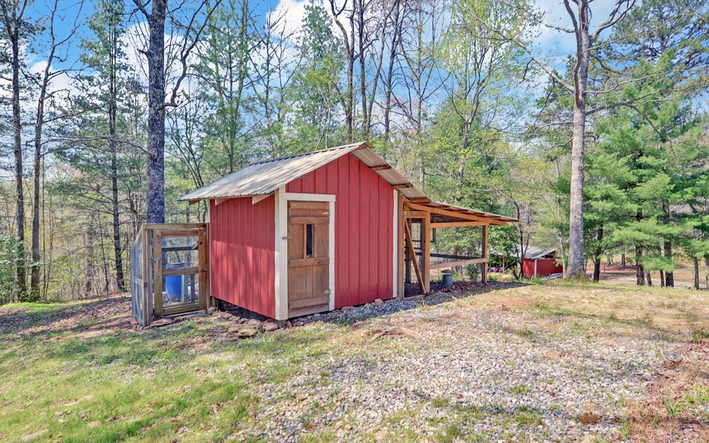 202 Dove Lane Morganton, GA 30560 - Photo 69 of 99 a view of a barn in the middle of a yard