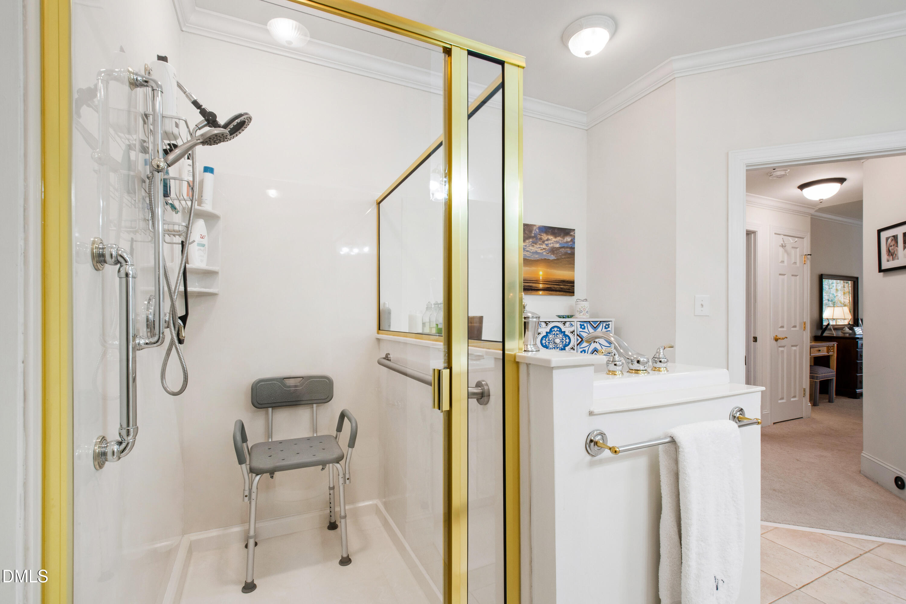 3700 Baron Cooper Pass, Unit 105 Raleigh, NC 27612 - Photo 25 of 49 a bathroom with a shower a sink and a mirror