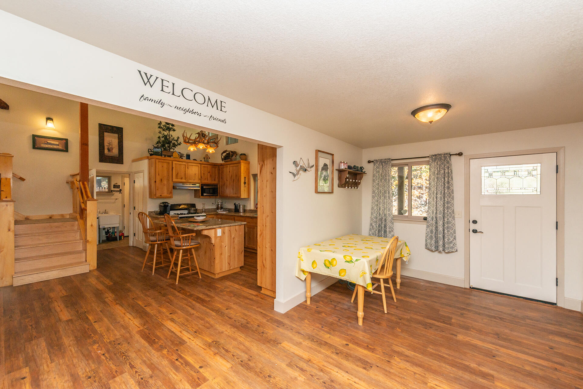 851 Mountain Aire Road Trinity Center, CA 96091 - Photo 35 of 54 a living room with furniture a dining table and chairs with wooden floor