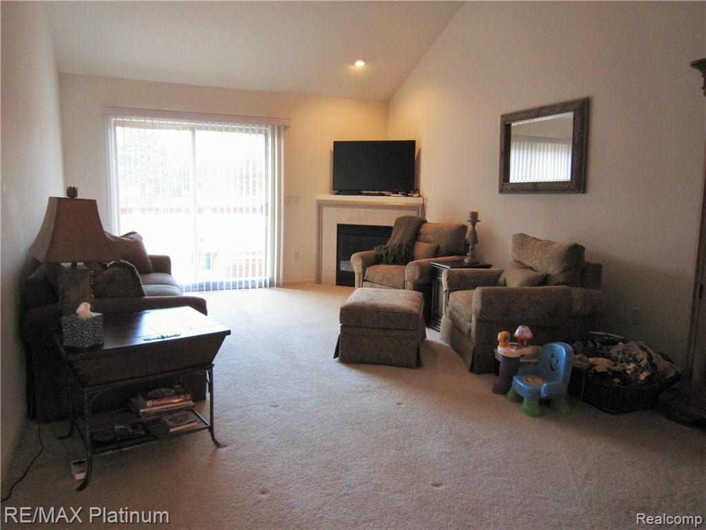 4663 Summer Ridge Drive Howell, MI 48843 - Photo 5 of 20 LIVING ROOM WITH FIREPLACE