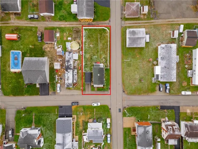 a aerial view of a residential apartment building with a yard