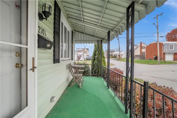a view of a porch with wooden floor and stairs