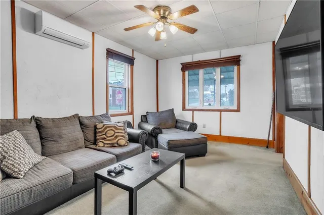 a living room with furniture and a window