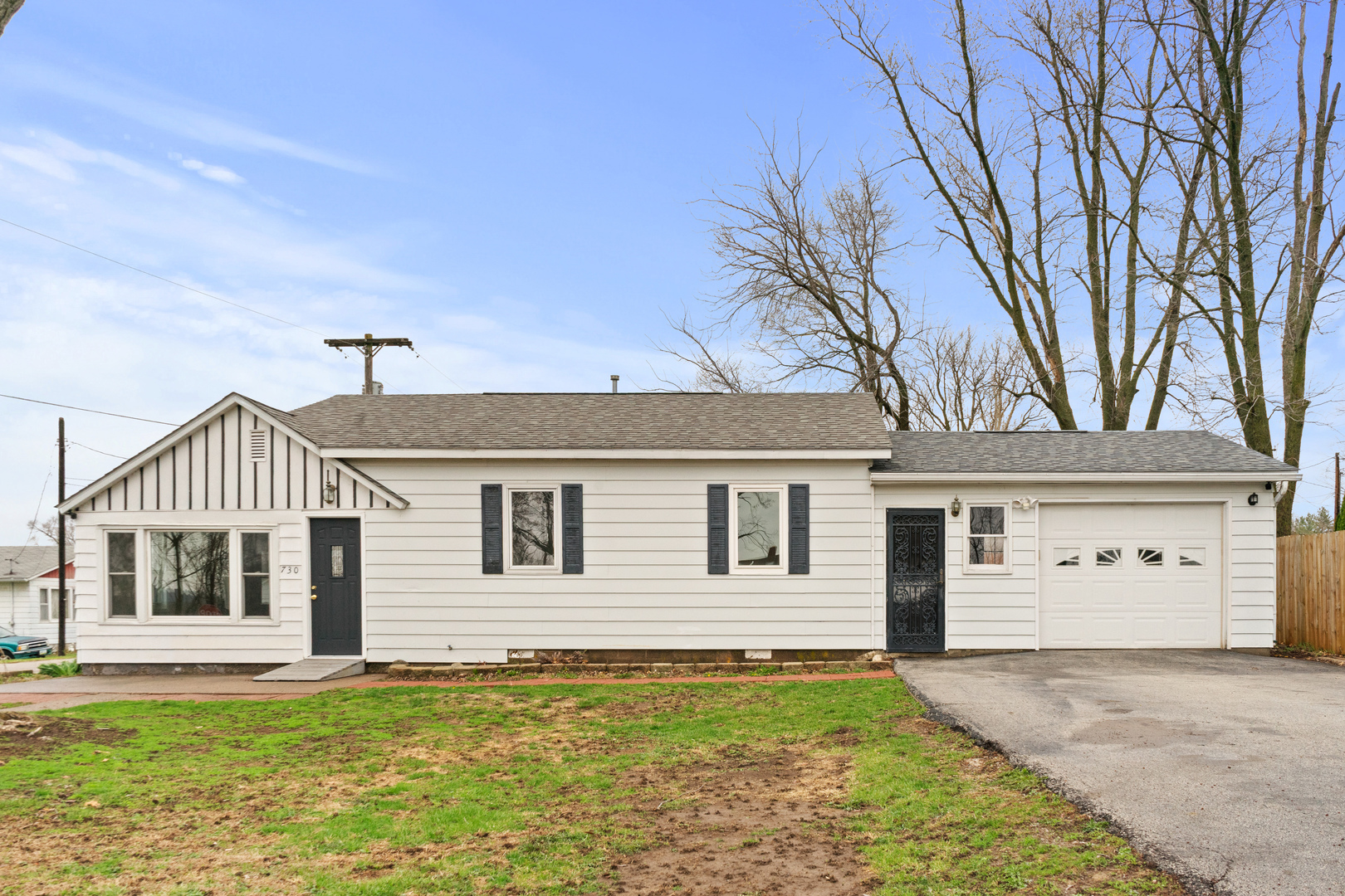 a view of a house with a yard