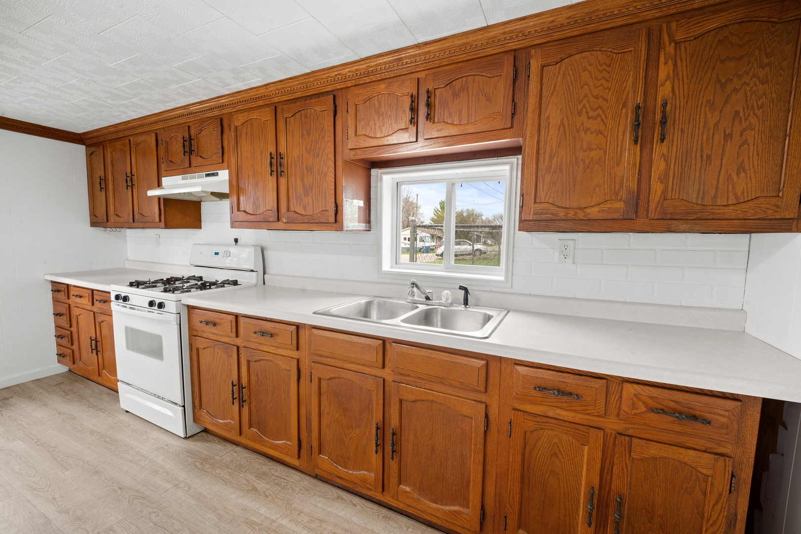 730 5th Street Buffalo, IA 52728 - Photo 6 of 16 a kitchen with stainless steel appliances granite countertop a sink stove and cabinets