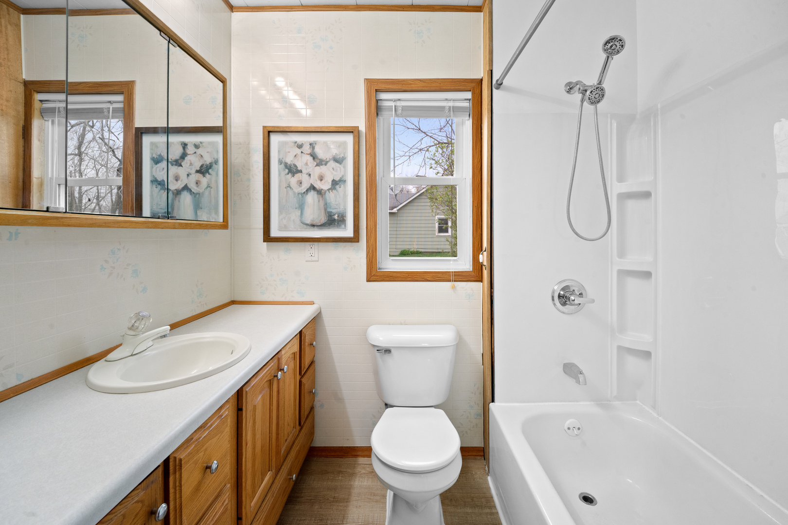 730 5th Street Buffalo, IA 52728 - Photo 9 of 16 a bathroom with a sink a toilet and shower