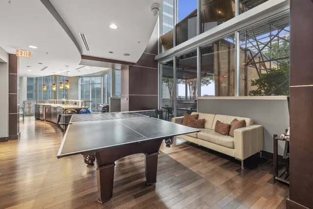 a room with wooden floor and furniture