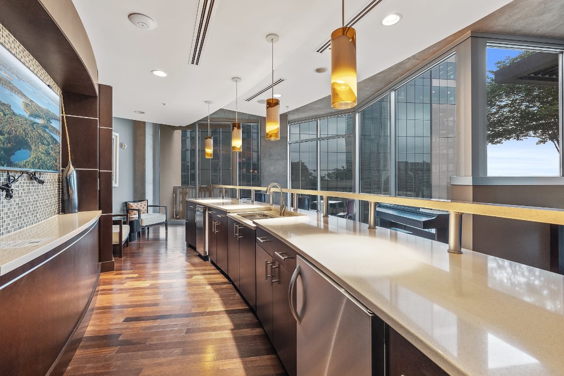 360 Nueces Street, Unit 911 Austin, TX 78701 - Photo 28 of 31 a large kitchen with stainless steel appliances a large counter top
