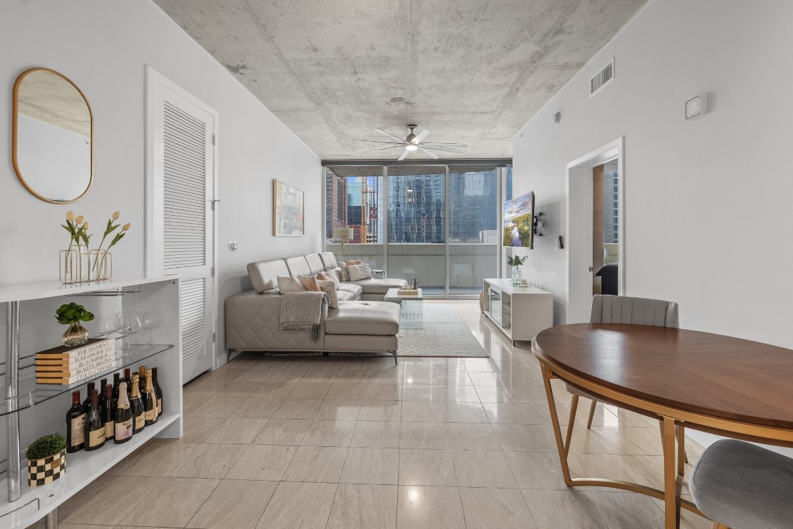 360 Nueces Street, Unit 911 Austin, TX 78701 - Photo 3 of 31 a living room with furniture and wooden floor
