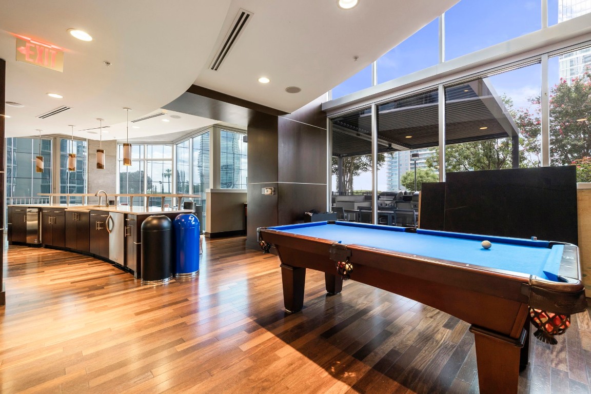 360 Nueces Street, Unit 911 Austin, TX 78701 - Photo 31 of 31 a living room with furniture a flat screen tv and a large window