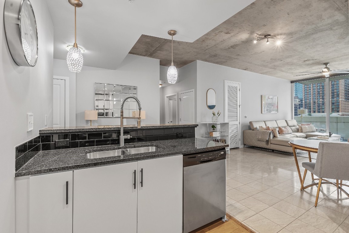 360 Nueces Street, Unit 911 Austin, TX 78701 - Photo 7 of 31 a kitchen with cabinets a sink and a stove