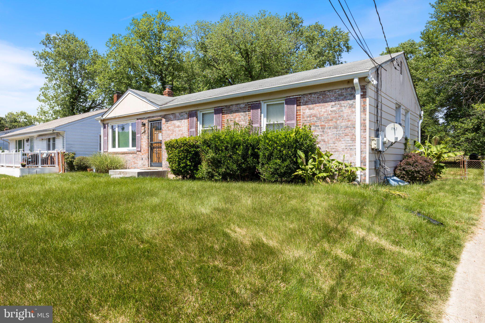 2514 Ritchie Road District Heights, MD 20747 - Photo 23 of 24 Charming brick home with lush greenery.