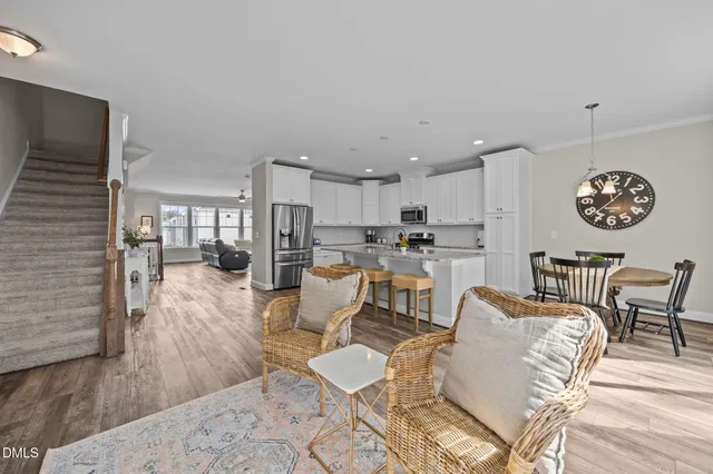 a dining room with furniture and windows