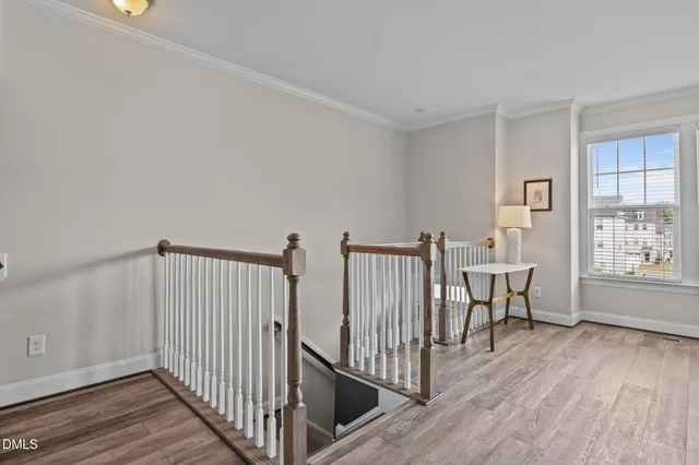 a kitchen with granite countertop white cabinets and stainless steel appliances