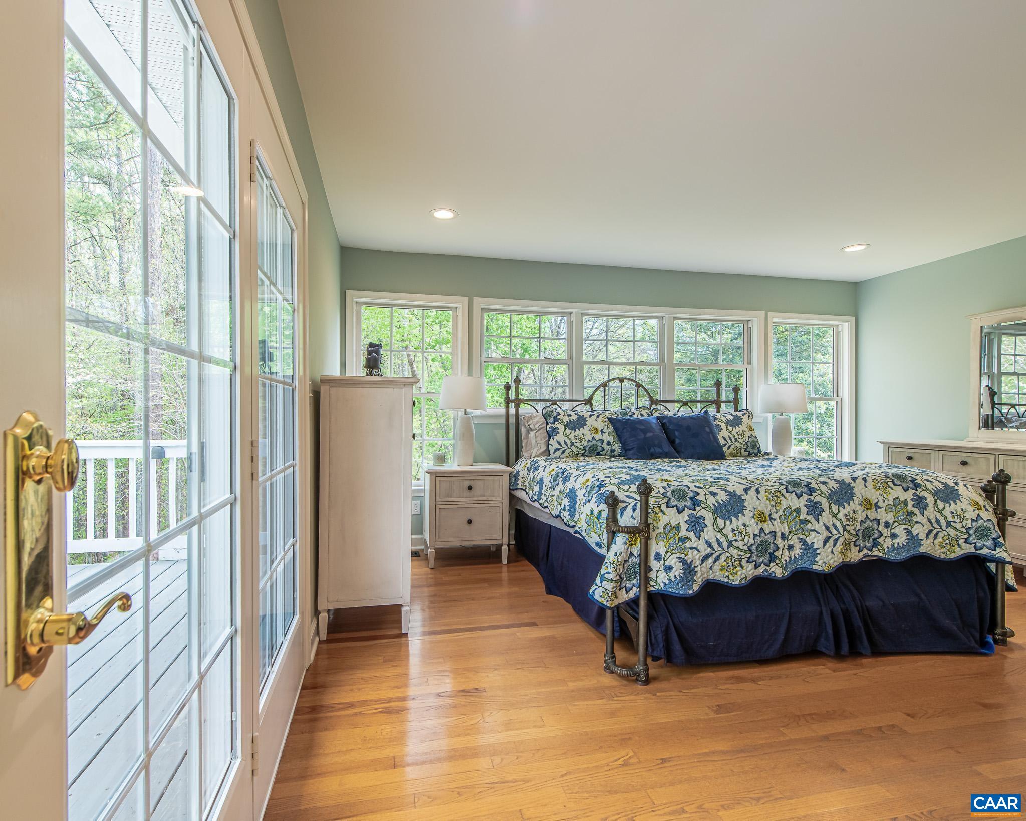 1089 Broken Island Road Palmyra, VA 22963 - Photo 39 of 74 a bedroom with a large bed and a large window