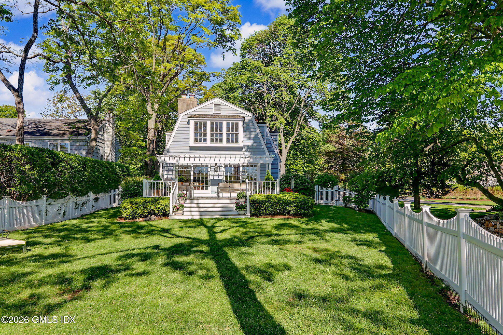 10 Newton Street Riverside, CT 06878 - Photo 24 of 28 a front view of a house with a yard table and chairs