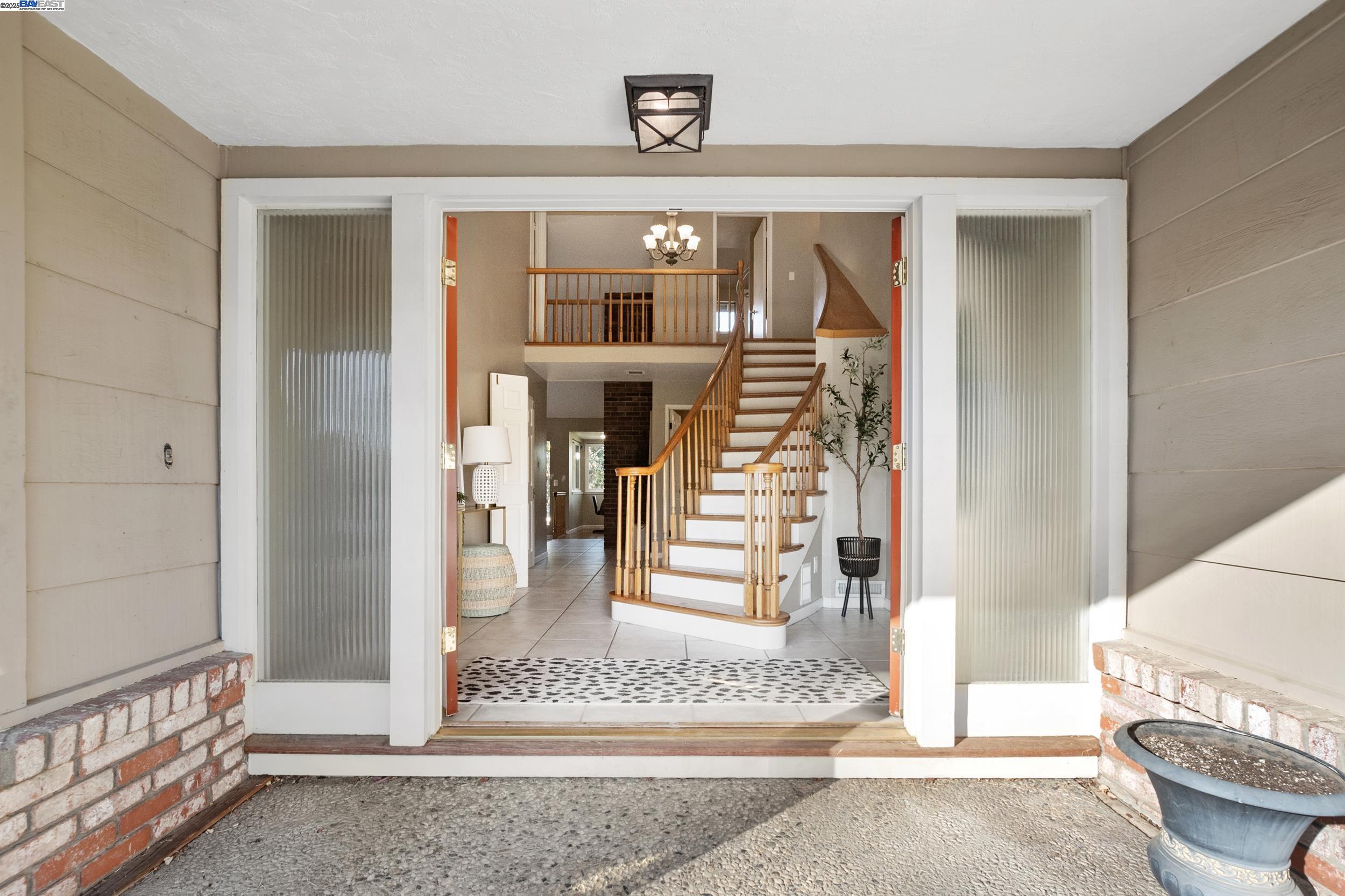 628 Lido Drive Livermore, CA 94550 - Photo 1 of 13 a view of a hallway with wooden floor and entryway