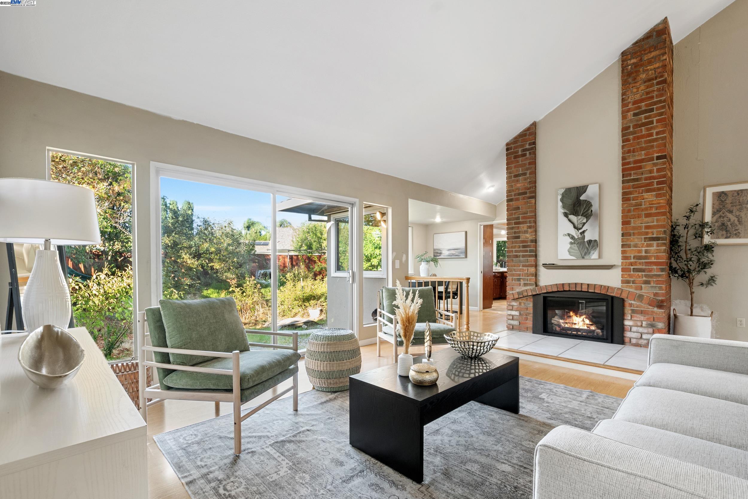 628 Lido Drive Livermore, CA 94550 - Photo 5 of 13 a living room with furniture fireplace and a large window
