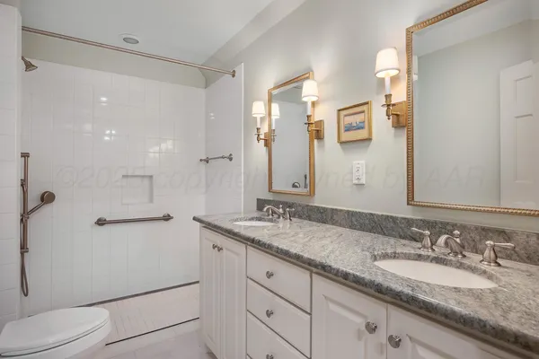 a view of entryway with bathtub and shower