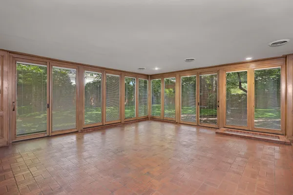 an empty room with furniture and a fireplace