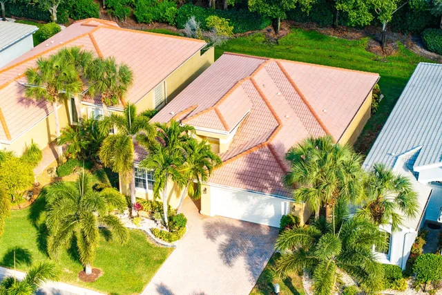an aerial view of residential house with swimming pool and outdoor space