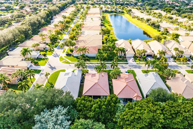 a view of a swimming pool with a table chairs