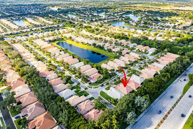 a view of a swimming pool with a yard
